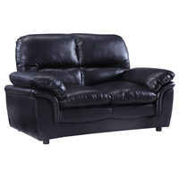 Black leather sofa on a white background
