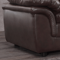 Brown leather recliner chair corner on a wooden floor