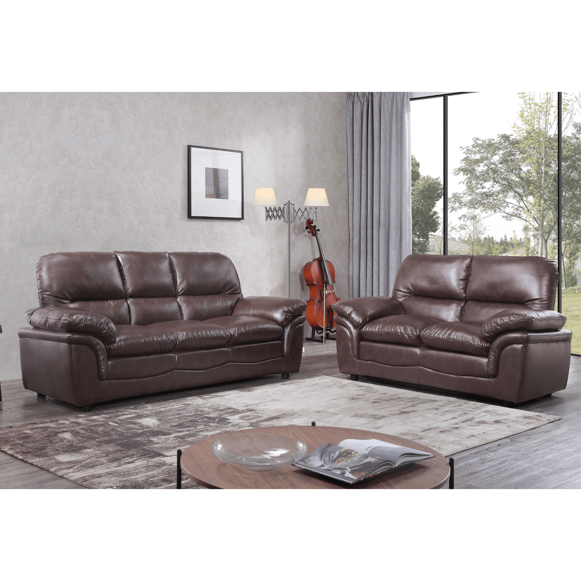 Brown leather sofa set in a living room with a rug and coffee table.