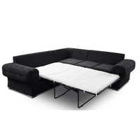 Black sectional sofa with a white mattress on a white background