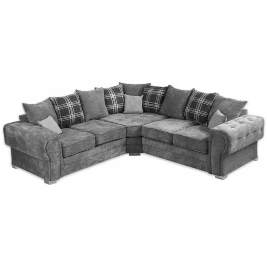 Gray sectional sofa with plaid and solid cushions on a white background