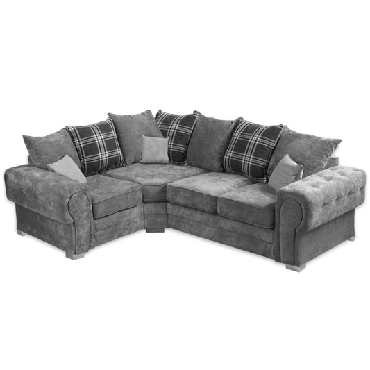 Gray sectional sofa with plaid and solid cushions on a white background